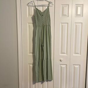 Sage jumpsuit with small white flower pattern
